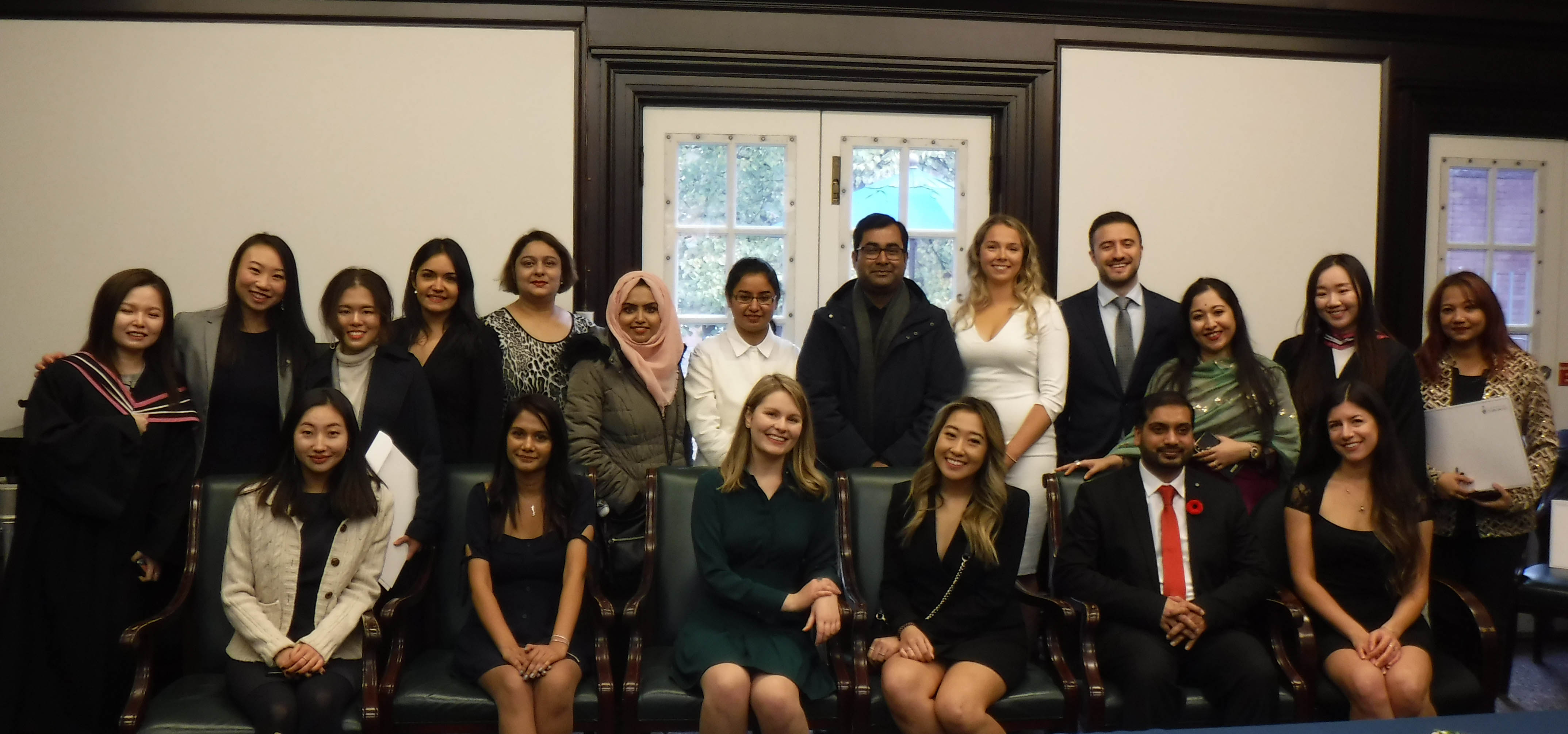 Graduating students pose in the library