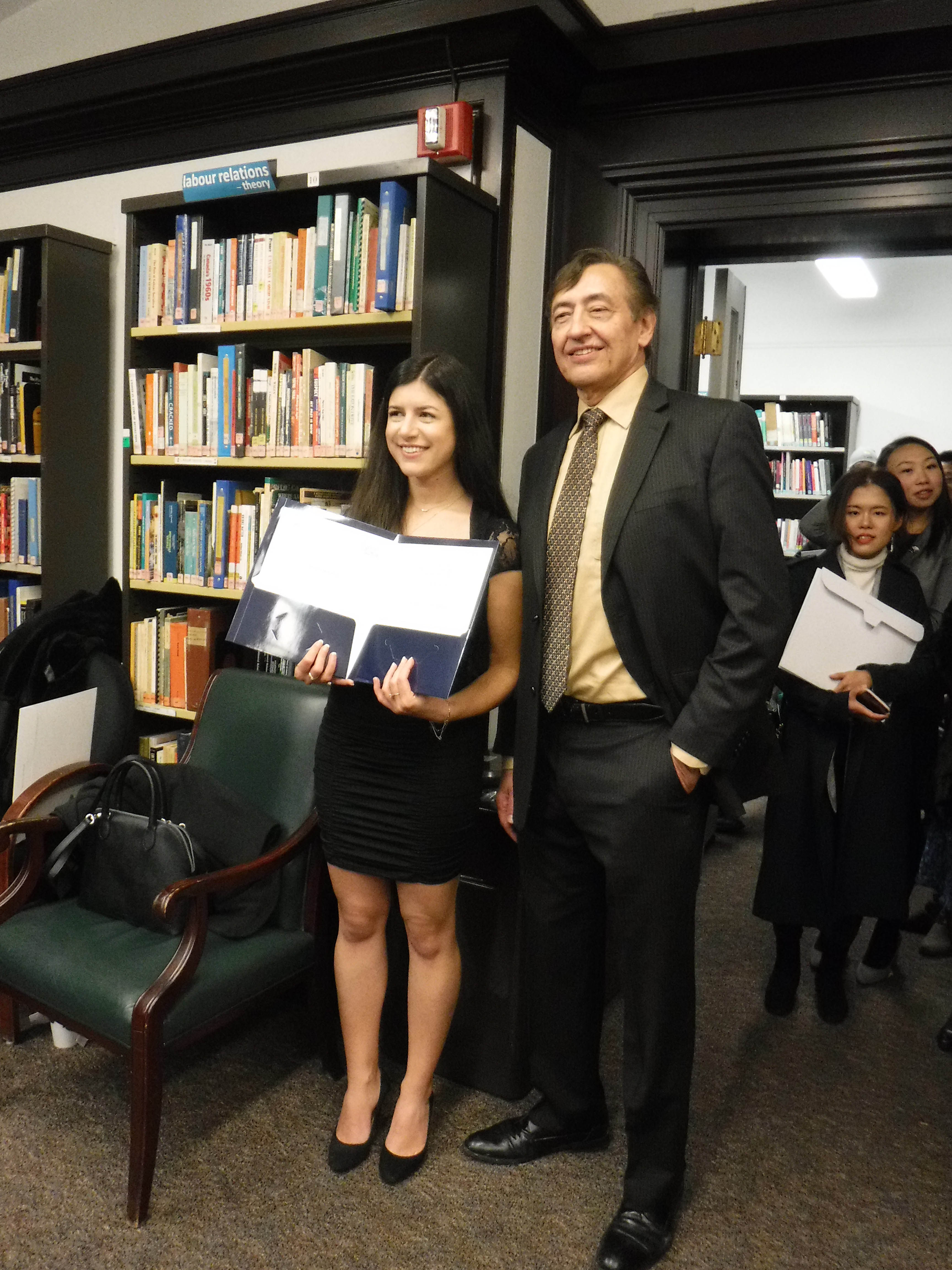 Ioana Petrar-Silca poses with Professor Frank Reid and her prize 