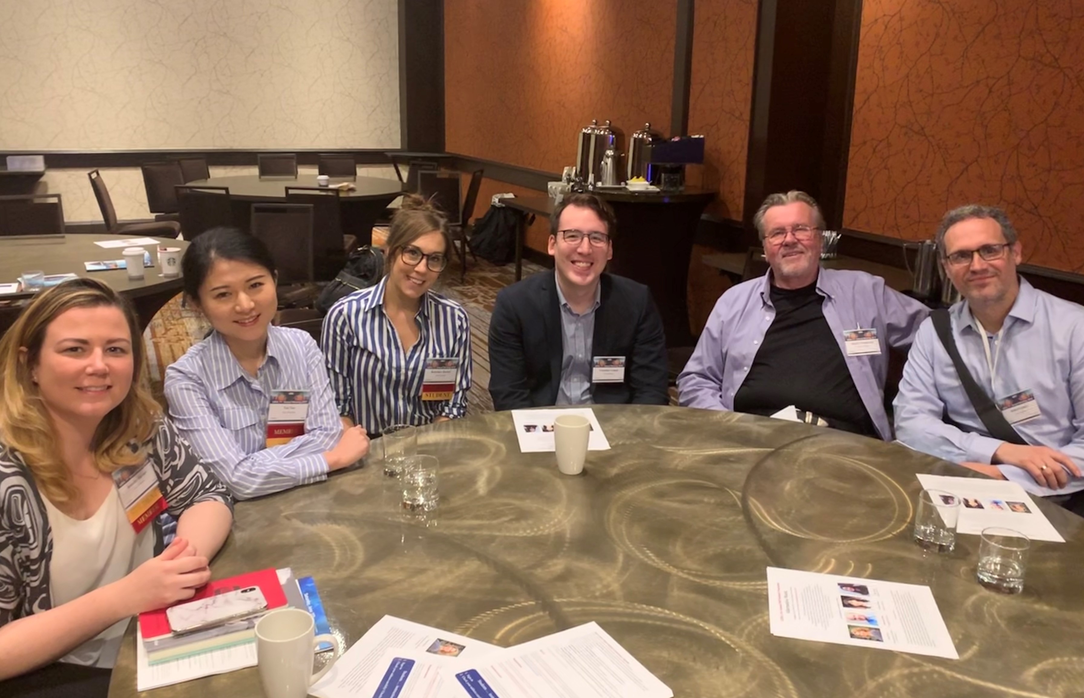 Students and faculty attend a conference session