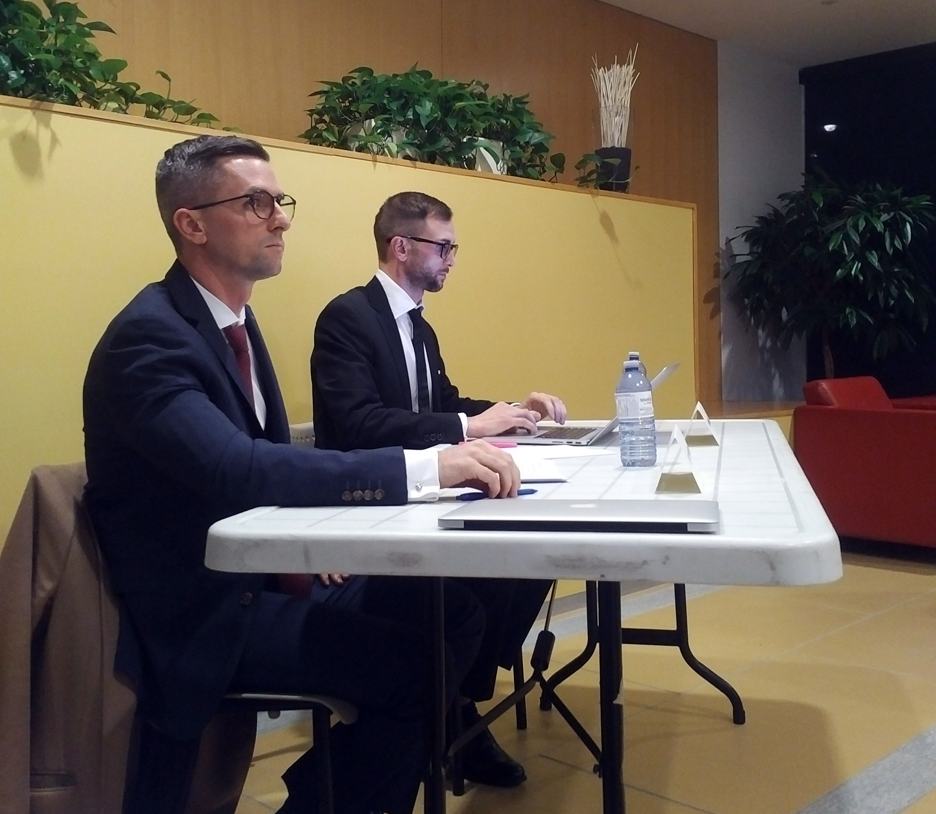 Shawn Meikle and Christopher Sider sit at a table