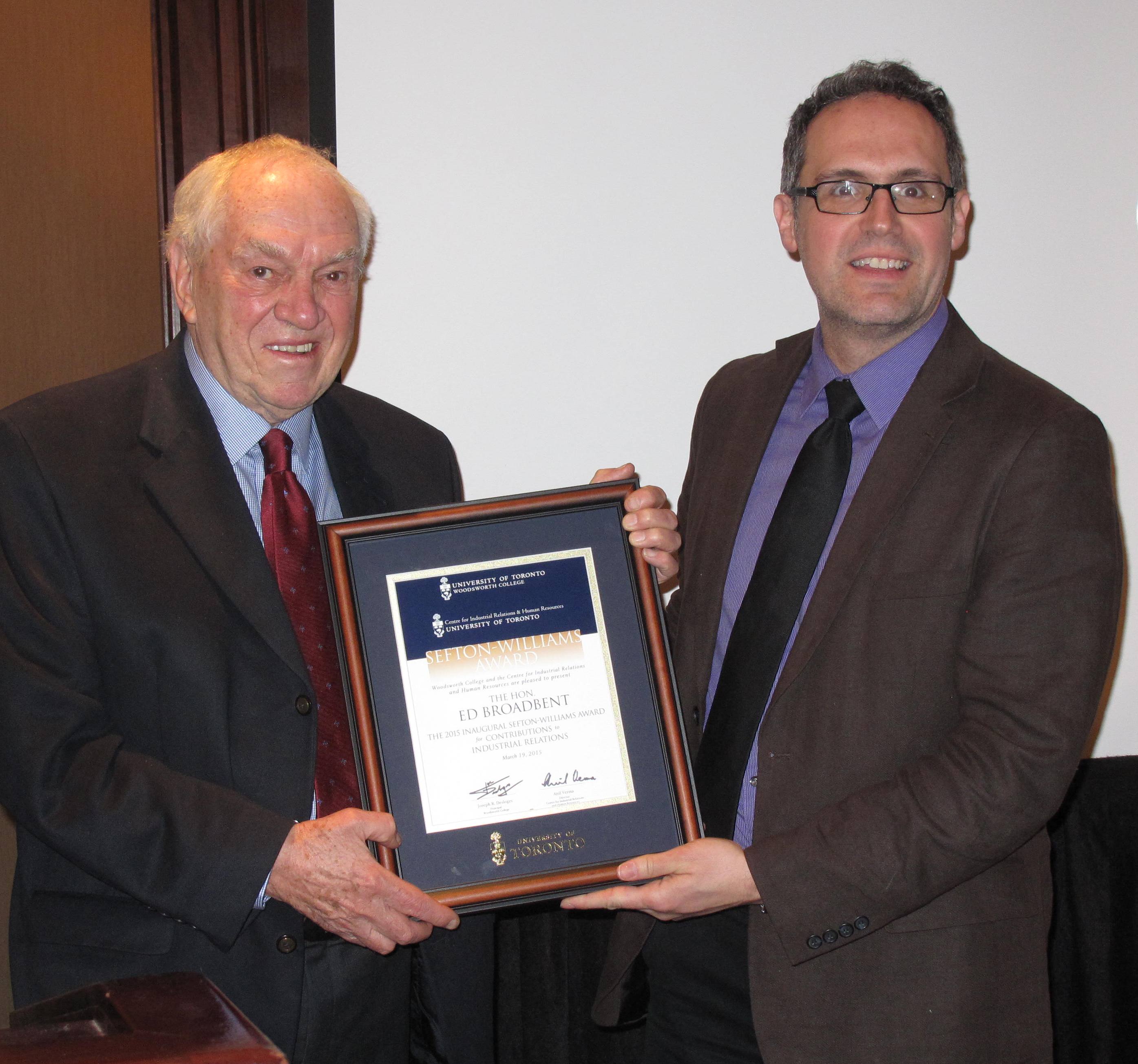 Rafael Gomez presenting the Sefton-Williams Award to Ed Broadbent