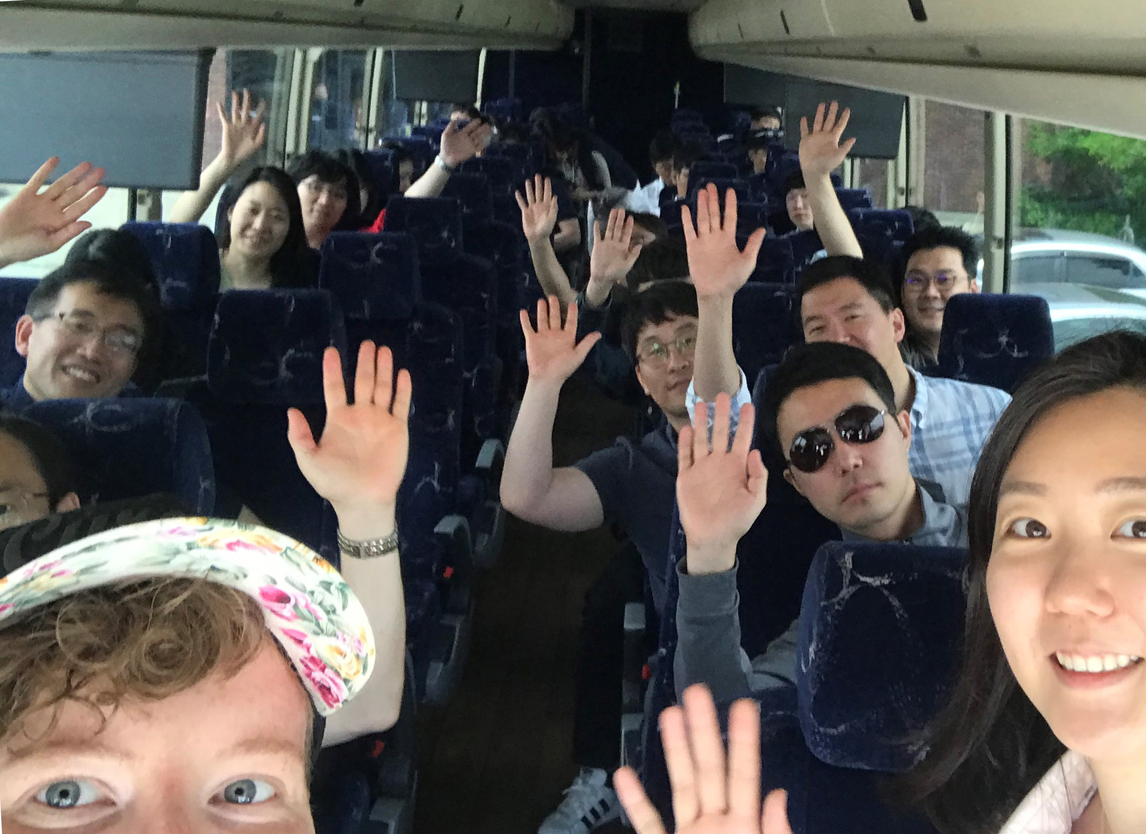 Group selfie on a coach bus