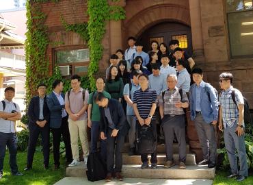 The group poses on the CIRHR steps