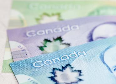 Close-up photo of Canadian $20, $10 and $5 bills